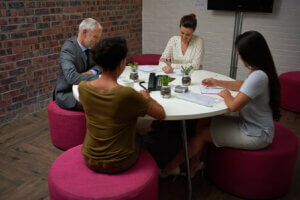 People talking around a table in a cafe