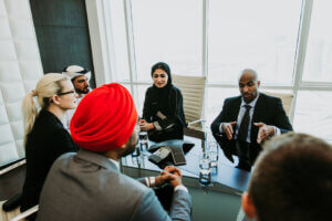 A group meeting seated in a circle in a modern office