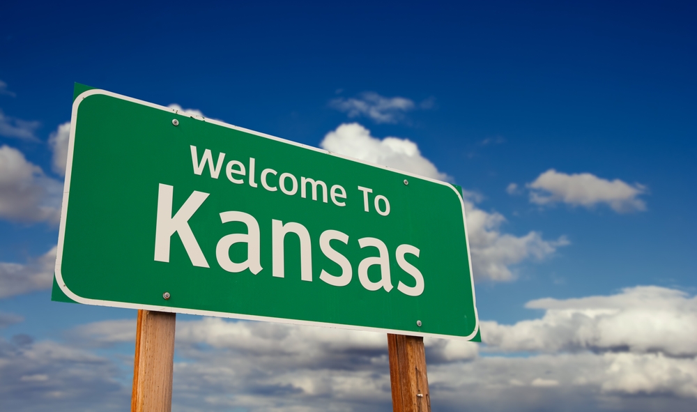 Kansas welcome sign representing the local communities and geographic reach that nonprofit donors help support through charitable giving.